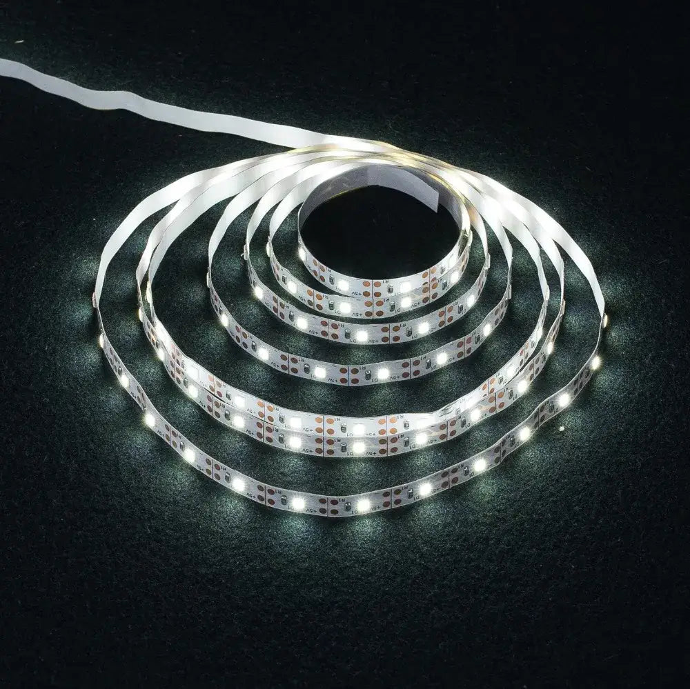 Coiled white decorbites™ led strip light smd2835 with bright bulbs and flexible adhesive backing for versatile use