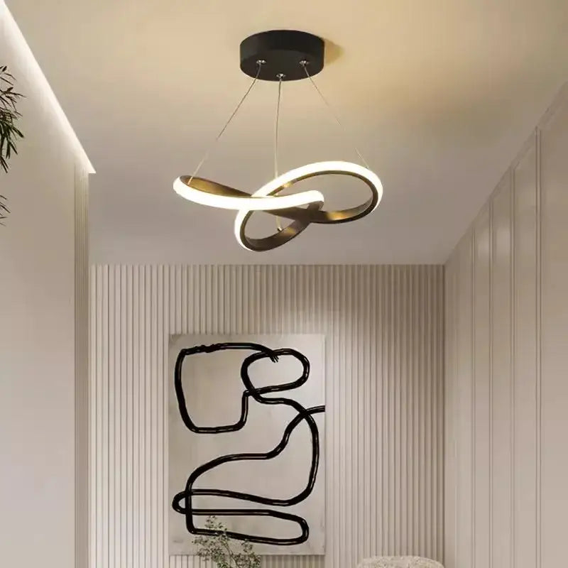 Modern black and gold pendant light with infinity-loop led strip modern design providing warm dining room decorbites lighting