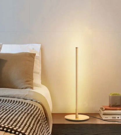 Decorbites led table lamp with slender gold metal stem and circular base ideal for bedroom study and office use