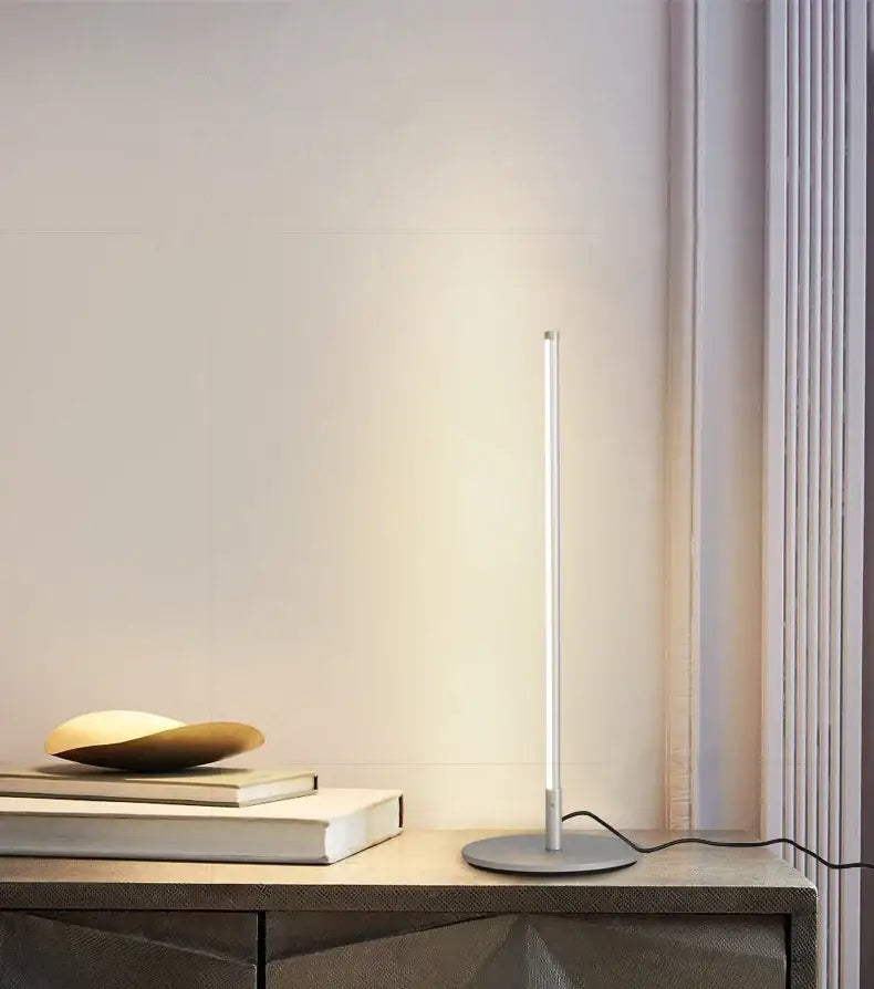 Minimalist white decorbites led table lamp with cylindrical design and circular base for bedroom and office use