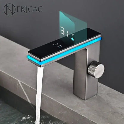 Modern matte black and brushed steel decorbites led temperature basin faucet with blue led display showing 31°c