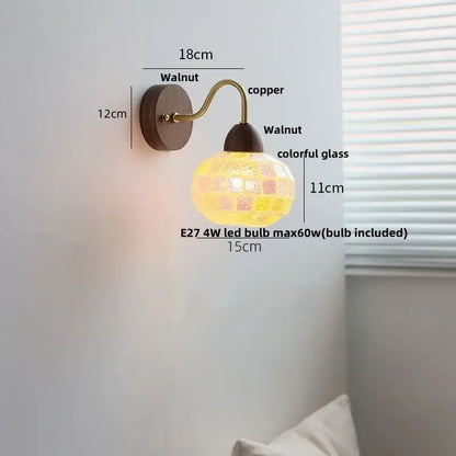 A warm-toned DecorBites led Tiffany style wall sconce with walnut base, copper arm, and colorful mosaic glass shade