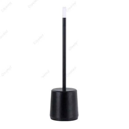 Black toilet brush with sleek cylindrical handle and white bristle head shown beside DecorBites led touch table lamp