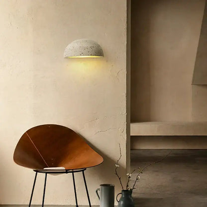 Minimalist decorbites led travertine wall light half-dome concrete sconce with warm yellow natural yellow ambiance light