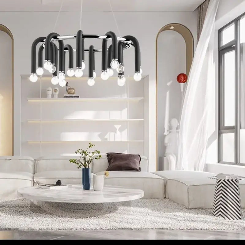 Black industrial-style decorbites led tube chandelier with curved metal arms and exposed bulbs for high ceiling lighting