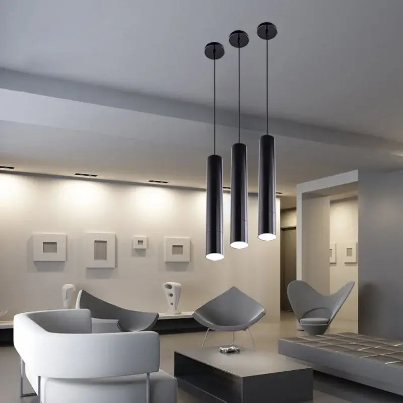 Three sleek black decorbites led tube pendant lights with modern finish for dining room and bar lighting