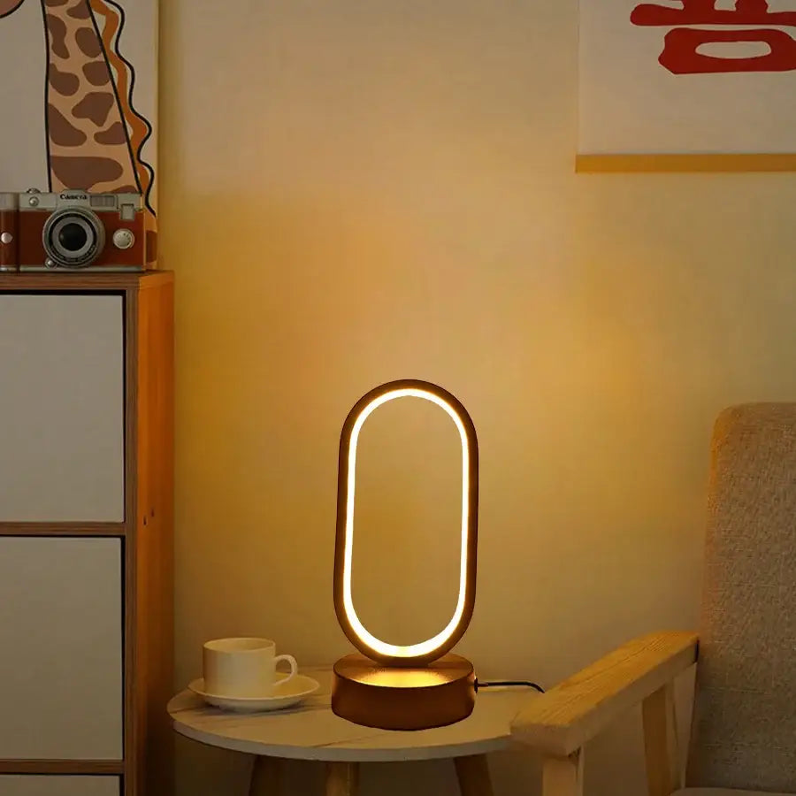 Modern oval-shaped decorbites led u-shaped lamp bedroom bedside decorative lamp with warm glow metallic frame and circular base