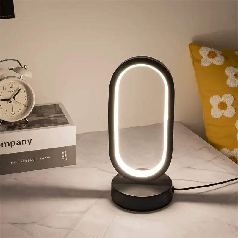 Modern black oval-shaped led lamp bedroom bedside decorative lamp with glowing ring for living room and study lighting
