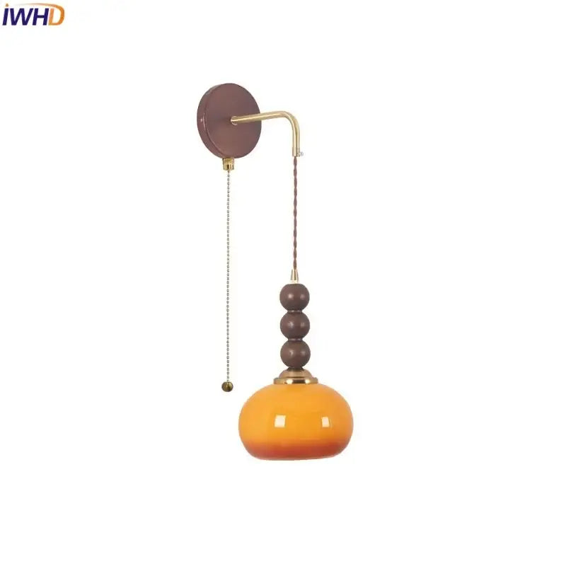 Orange gradient glass pendant light with brass accents and dark brown wooden beads from decorbites led wall collection