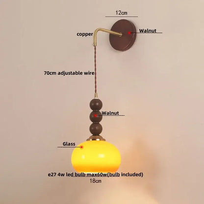 Decorbites led wall orange glass pendant light with warm yellow globe, copper mount, and dark walnut bead accents