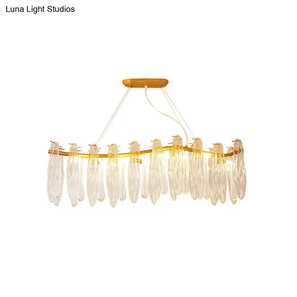 Gold-toned DecorBites™ linear island lamp with 8 clear K9 crystal teardrop pendants for living room lighting