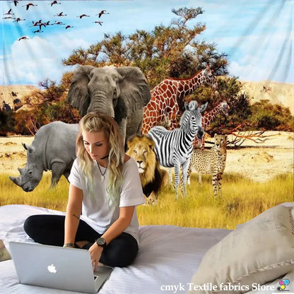 Silver apple laptop displayed next to decorbites lion tapestry featuring silver grassland animal design for bedroom decor