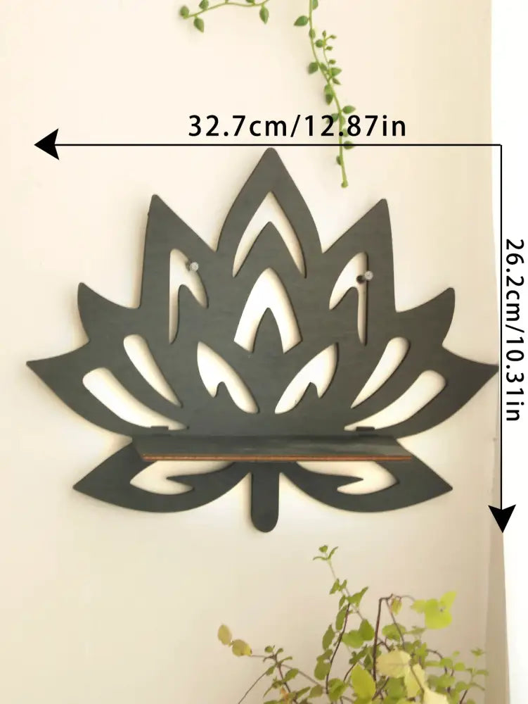 Dark gray metal lotus floating wall shelf with sleek cut-out design and integrated wooden support bar by decorbites