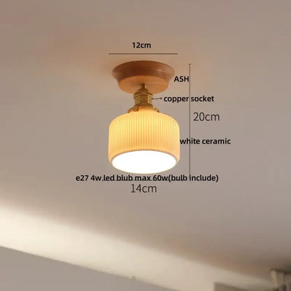 A warm-toned decorbites lotus glass led ceiling light with wooden ash base and copper socket supporting white ceramic shade