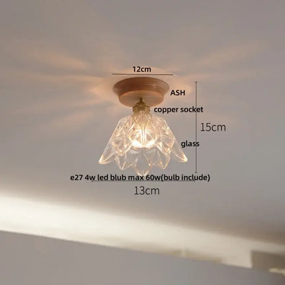 Decorbites lotus glass led ceiling light with a clear faceted glass pendant, copper socket, and wooden base in modern nordic design