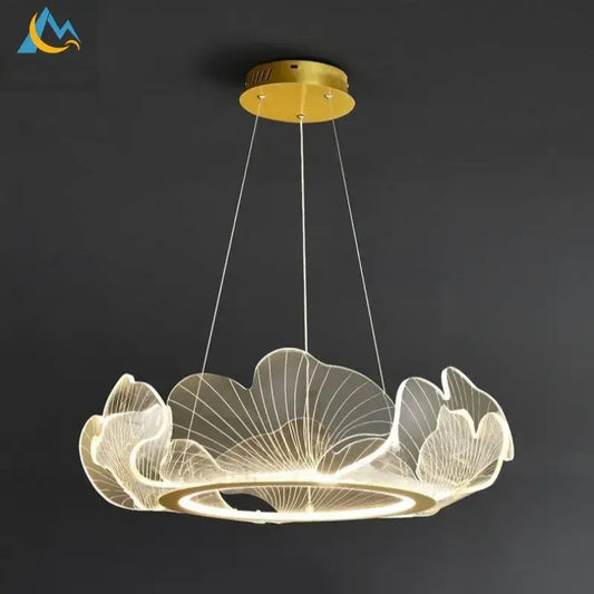 A modern gold-toned DecorBites lotus leaf pendant light with translucent acrylic leaves emitting warm glow