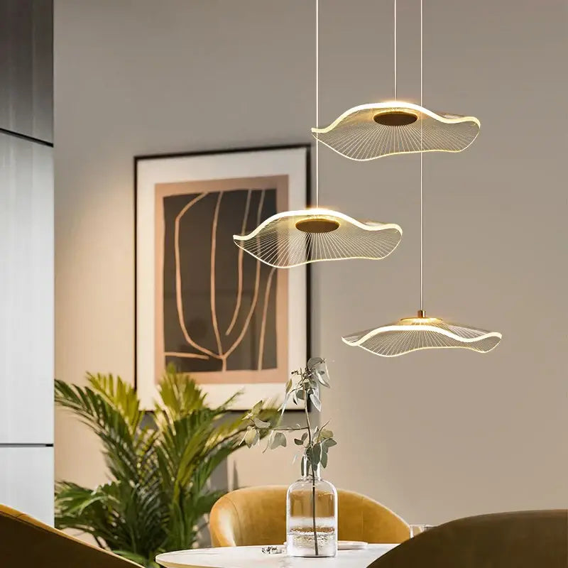 Modern gold-toned decorbites lotus leaf pendant lights with wave-shaped acrylic design and delicate wireframe detailing