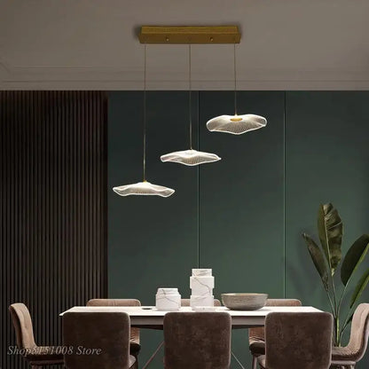 Three elegant white fan-shaped acrylic pendant lights with wireframe design in decorbites lotus leaf chandelier