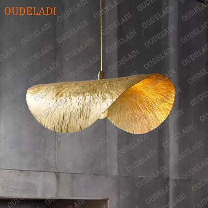 Golden leaf-shaped pendant light with textured metallic finish and twisted design in decorbites lotus leaf copper chandelier