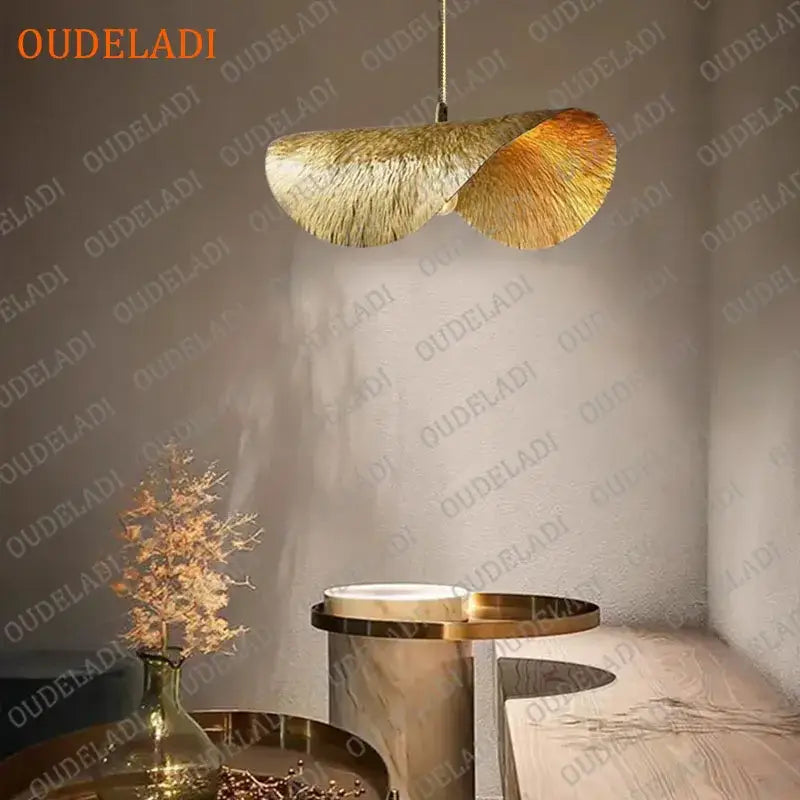 Golden feather-like pendant light with textured metallic finish hanging from chain for kitchen island decorbites lotus leaf copper chandelier