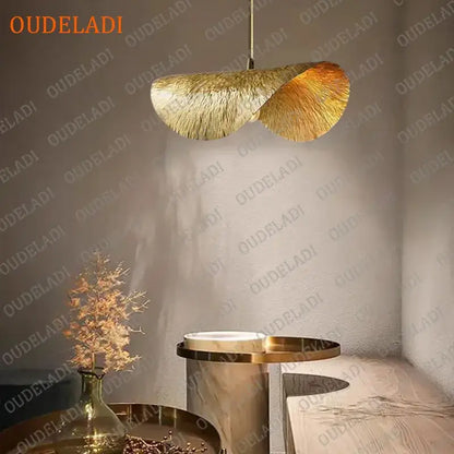 Golden feather-like pendant light with textured metallic finish hanging from chain for kitchen island decorbites lotus leaf copper chandelier