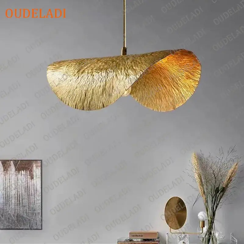 Gold-toned decorbites lotus leaf copper pendant light with textured metallic finish for vintage kitchen island decor