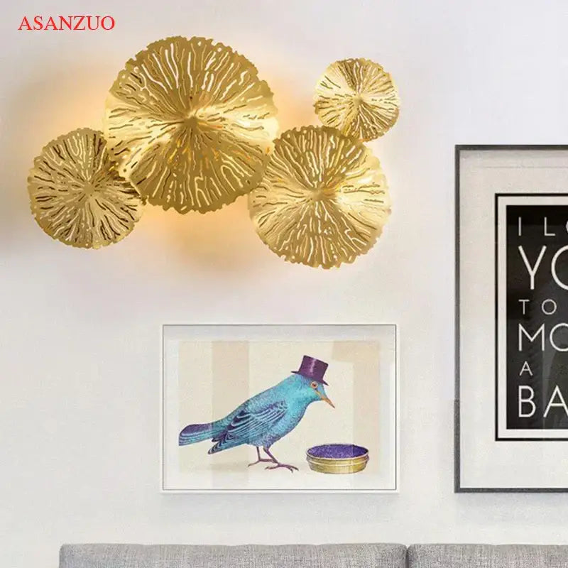 Gold-colored copper wall lamp with intricate veined leaf design decorbites lotus leaf for elegant home decor lighting