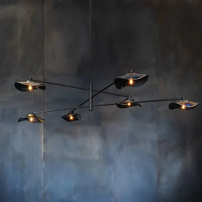 Modern black metal ceiling chandelier with five lotus leaf glass shades emitting warm light by DecorBites Lotus Leaf