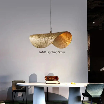 A modern gold-toned decorbites lotus leaf pendant lamp with textured leaf design for living room and restaurant use