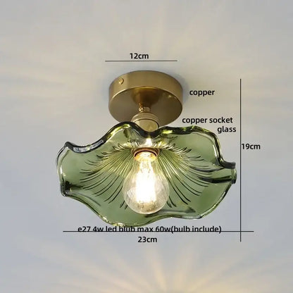A delicate green glass decorbites lotus leaf led ceiling lamp with copper mounting base and intricate leaf design