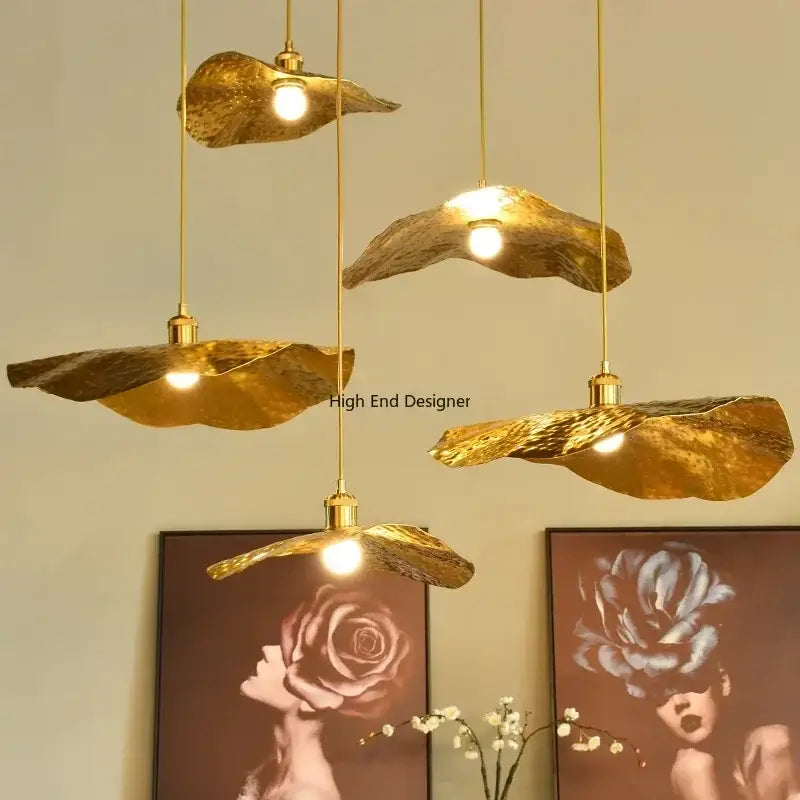 Gold leaf-shaped lotus leaf led pendant lights with hammered finish and slender brass cords by decorbites lotus leaf