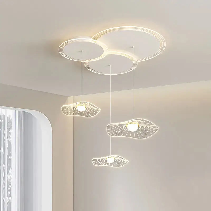 Modern minimalist pendant light with delicate leaf-shaped wire frame and warm white led bulbs by DecorBites lotus leaf