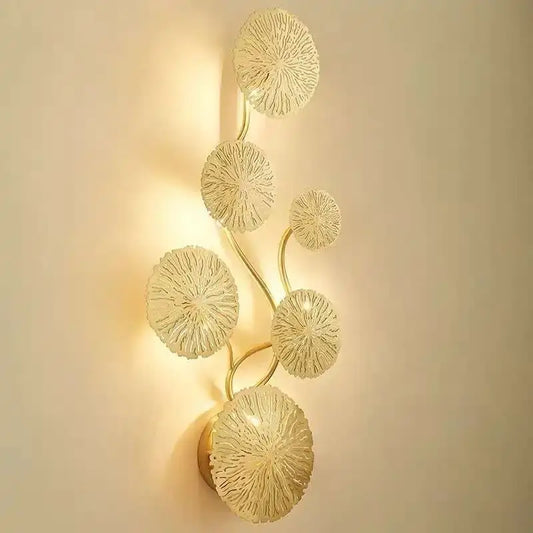 Gold-toned decorbites lotus leaf wall lights with translucent textured glass discs in vertical vine pattern for living room and bedroom