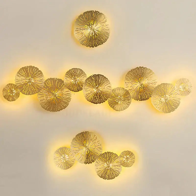 Golden copper decorbites lotus leaf led wall sconce with intricate texture and warm ambient lighting for indoor decor