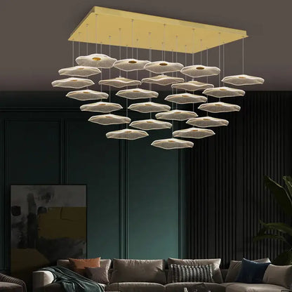 Modern gold rectangular ceiling fixture with white petal-shaped pendants in decorbites lotus leaf nordic chandelier design