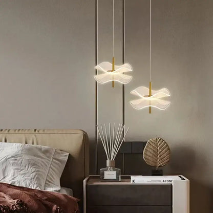 Two elegant translucent white decorbites lotus leaf pendant lights with gold-toned rods for restaurant and bedroom use