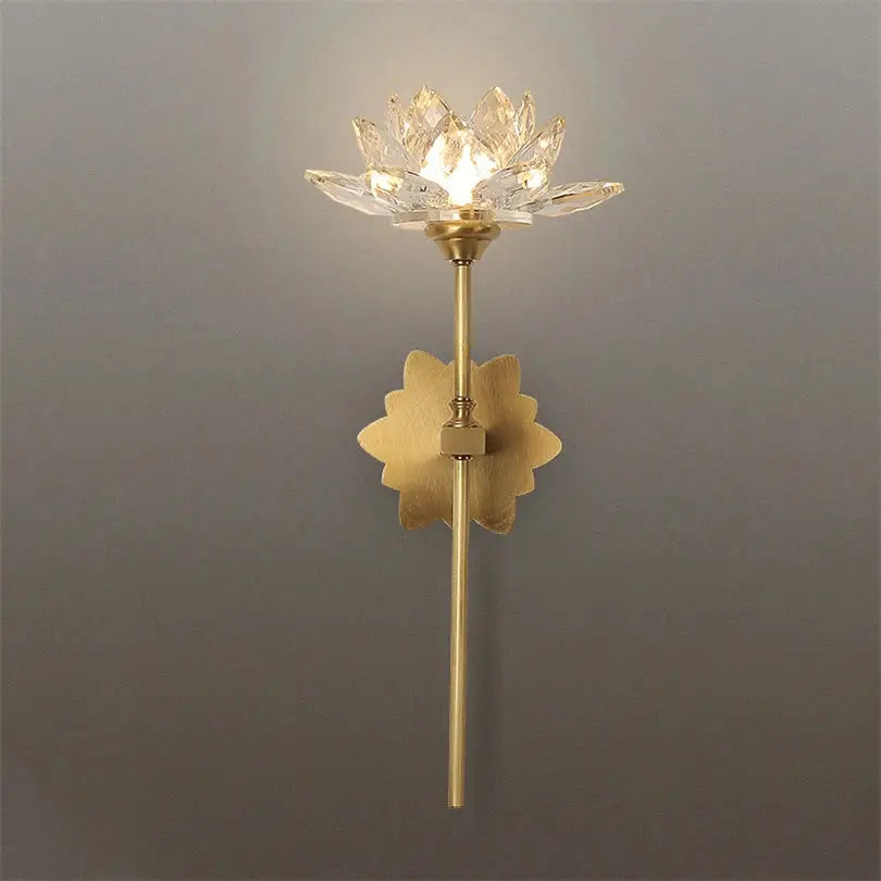Delicate gold-toned decorbites lotus led wall lamp with crystal lotus design and ornate leaf base for bedroom decor