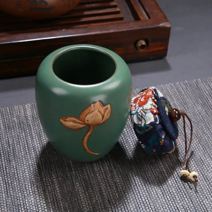 A jade-green ceramic pot storage jar with hand-painted lotus pattern for vintage chinese tea pot storage