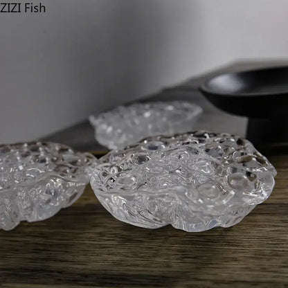 Clear glass coasters shaped like lotus leaves featuring intricate texture in decorbites lotus seedpod resin sculpture design