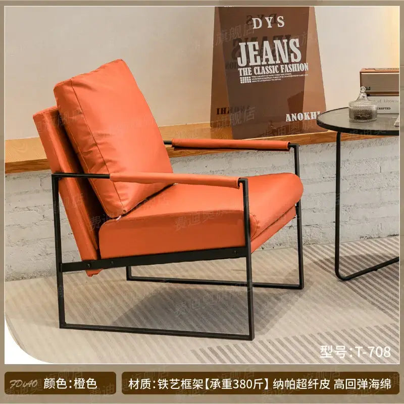 Orange leather decorbites lounge chair with black metal frame for casual comfort in coffee shop or reception area