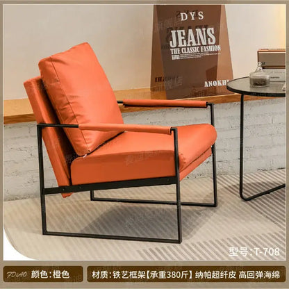 Orange leather decorbites lounge chair with black metal frame for casual comfort in coffee shop or reception area