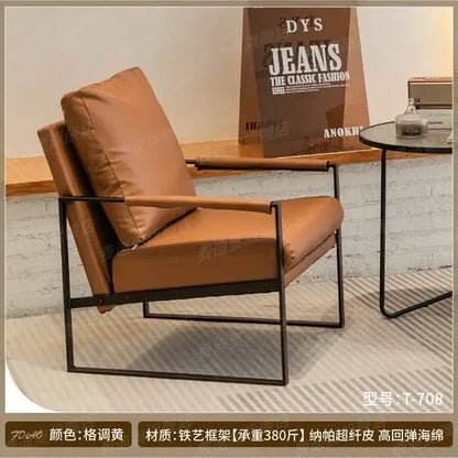 Tan leather decorbites lounge chair with black metal frame for casual comfort in coffee shop or hotel balcony
