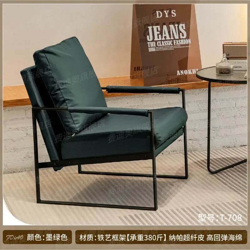 Dark green upholstered decorbites lounge chair with black metal frame ideal for coffee shop and hotel balcony seating