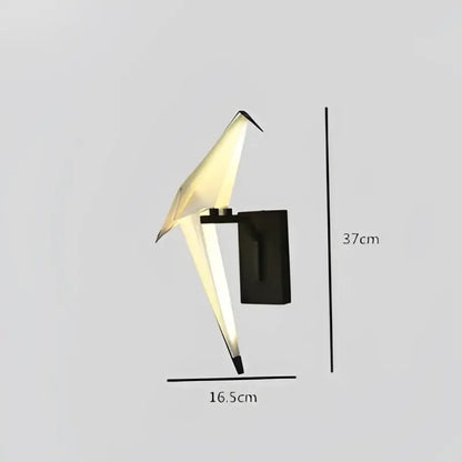 A sleek black and white origami style love bird chandelier wall sconce with glowing interior light by DecorBites Love Bird