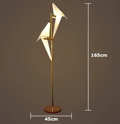 Gold-finished floor lamp with white origami paper wings from decorbites love bird chandelier for elegant dining rooms