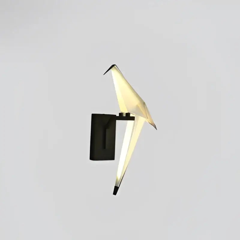 DecorBites™ Love Bird led wall sconce with black iron base and translucent white acryl wings emitting warm glow