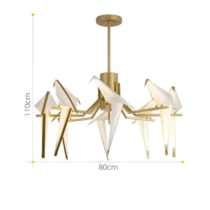 Gold-toned origami crane led wall sconce with white paper birds and illuminated glass panels for bedroom corridor lighting