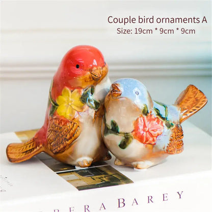 Ceramic love birds porcelain couple ornament with hand-painted red blue and orange floral designs by DecorBites love birds
