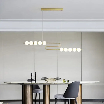Decorbites love gold chrome chandelier featuring gold-toned pendant with frosted glass spheres for dining room lighting