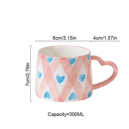 DecorBites love heart ceramic mug with pink and blue heart patterns and a matching heart-shaped handle for Valentine’s Day